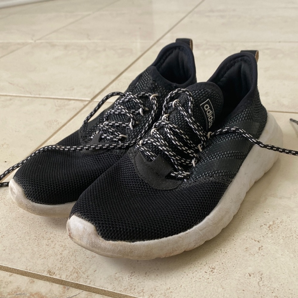 Black adidas running sneakers.